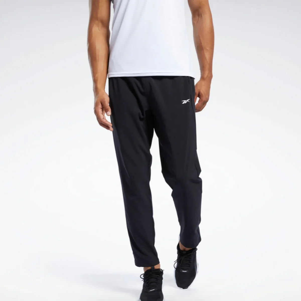 REEBOK Trenerka TRAIN WOVEN PANT - 100038337