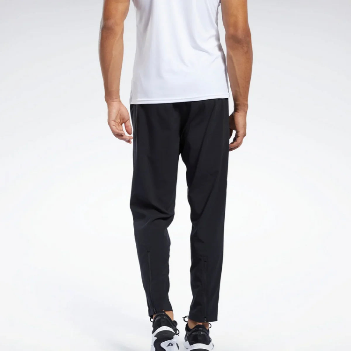 REEBOK Trenerka TRAIN WOVEN PANT - 100038337