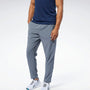 REEBOK Trenerka TRAIN WOVEN PANT